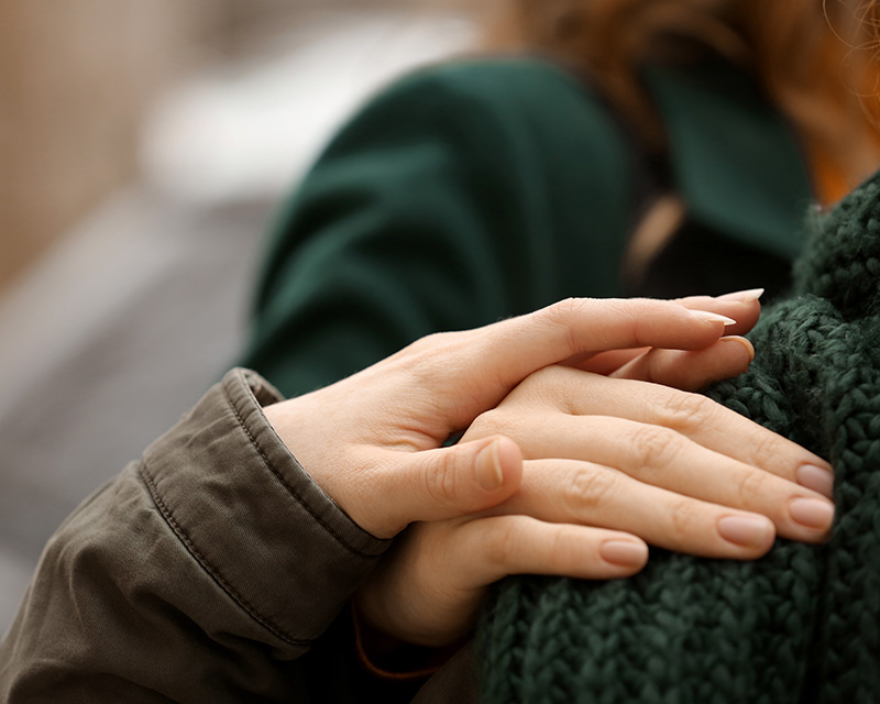 therapy_helpers_colorado Woman putting her hand on another woman's hand; therapy for helpers in Denver