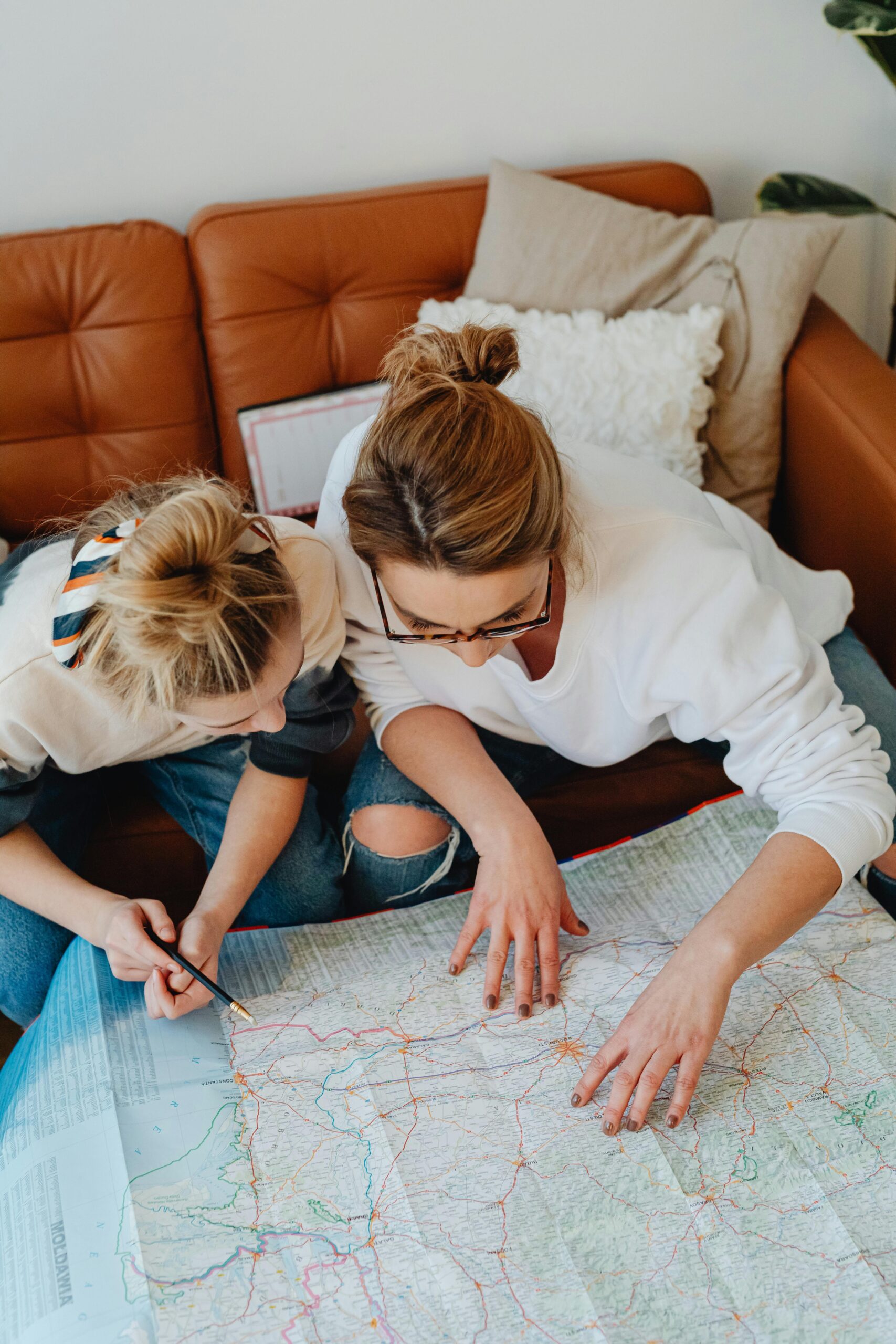 Parent and child planning summer activities while feeling overwhelmed during summer break