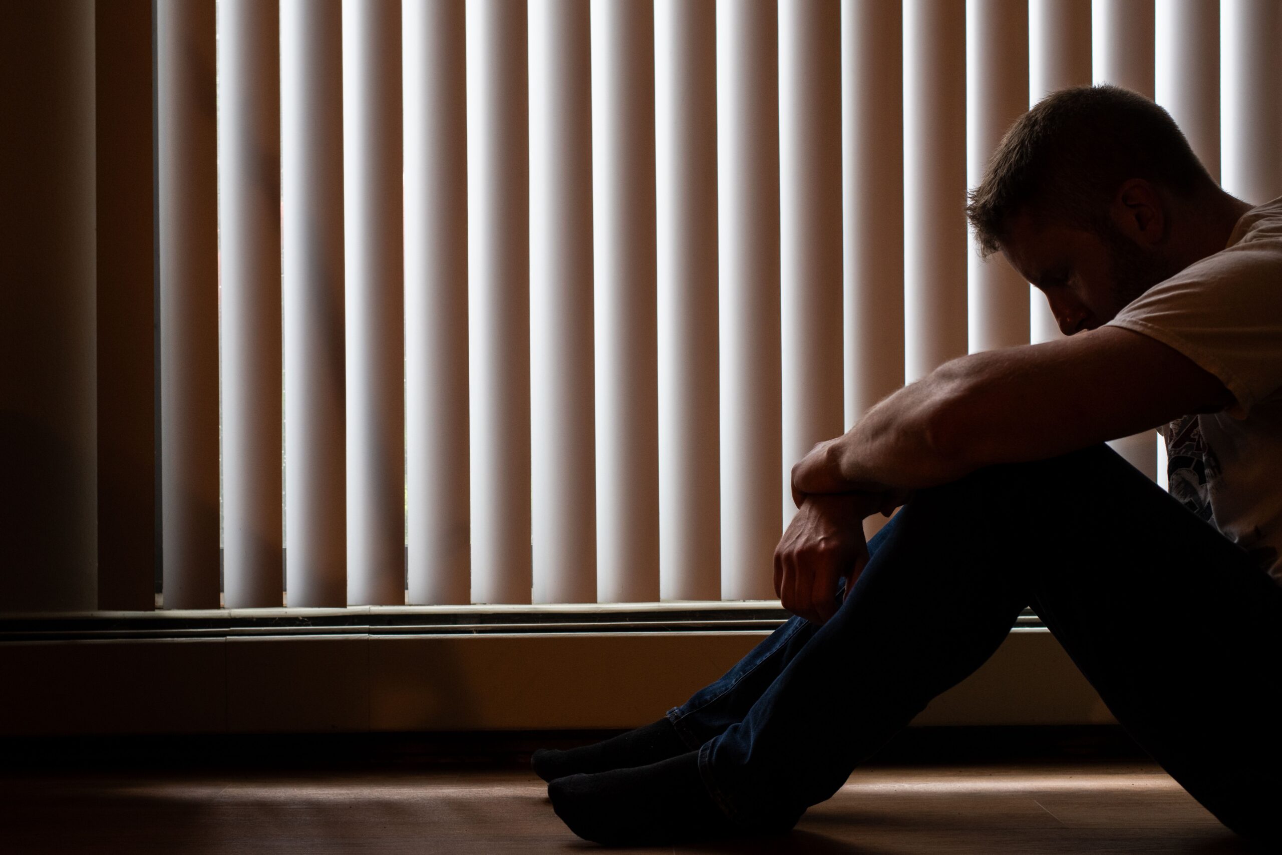 Depression Person in dark lighting experiencing depression